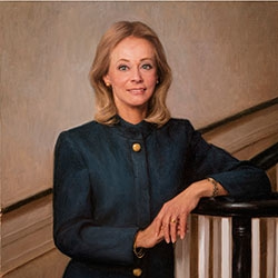 commissioned portrait of a blond-haired woman in button-up blue pants suit.