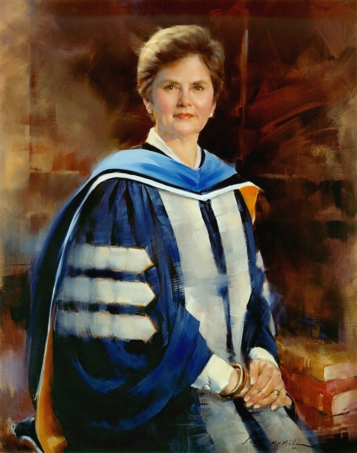commissioned portrait of short-haired woman, hands crossed over one another, in academic dress. 